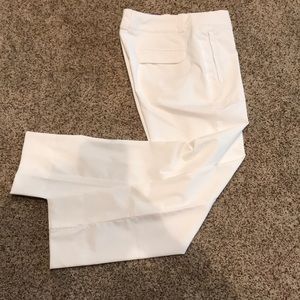 Woman’s white Nike Golf Dri Fit golf pants